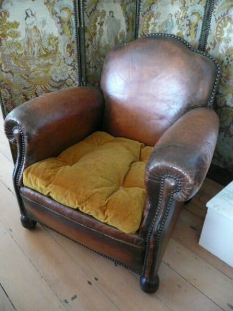 Single 1920s French leather studded club chair