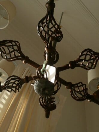 1950s six arm hand forged iron chandeliers