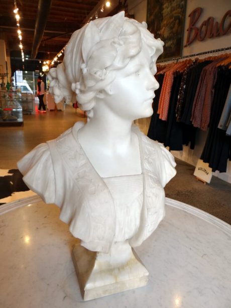 Signed marble bust of young woman with laurel crown