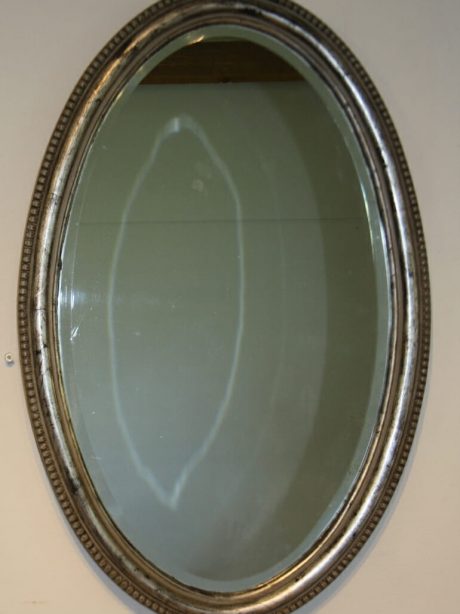 English oval mirror with silver leaf frame c.1910