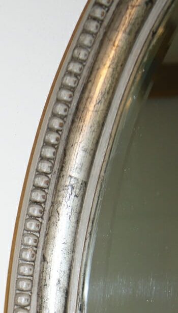 English oval mirror with silver leaf frame c.1910