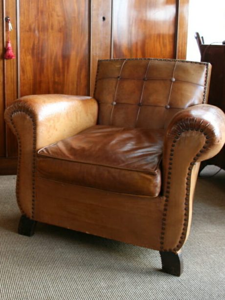 Pair of leather club chairs with panelled backs c.1950