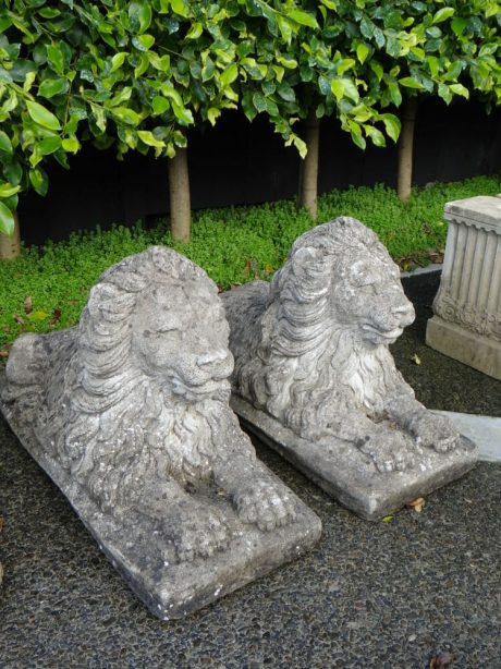 Pair of composite stone lions with nicely aged patina