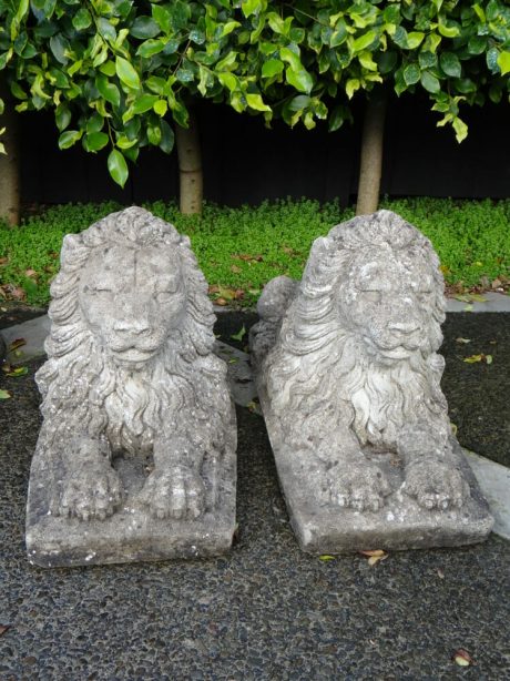 Pair of composite stone lions with nicely aged patina