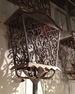 Two pairs of hand forged metal courtyard lanterns