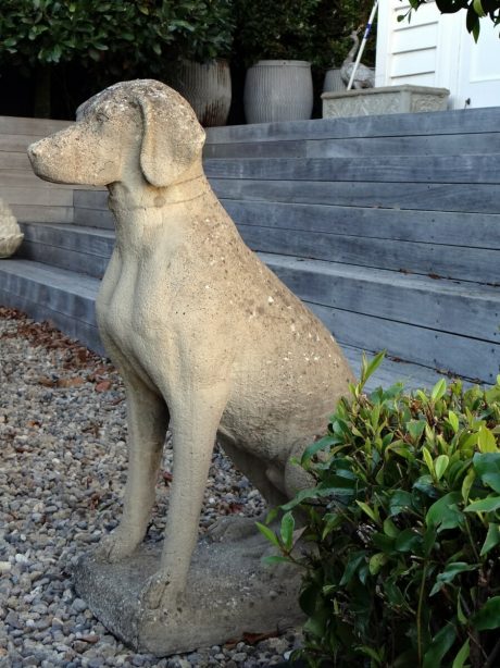 Pair of reconstituted stone dogs with nice weathering