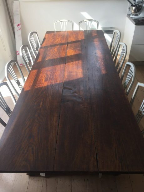 A dining table constructed from 80 year old oak