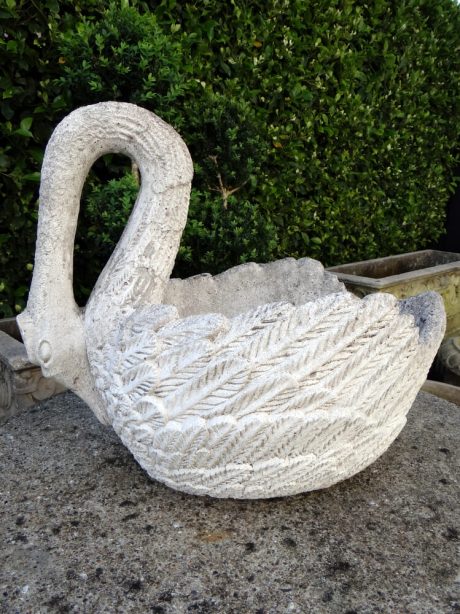 A pair of 20th century reconstituted stone swans