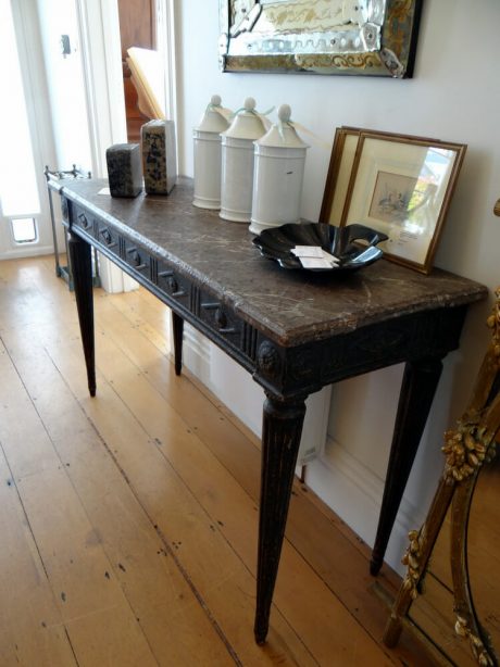 A beautiful console table in the style of Louis XVI