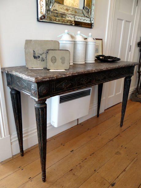 A beautiful console table in the style of Louis XVI