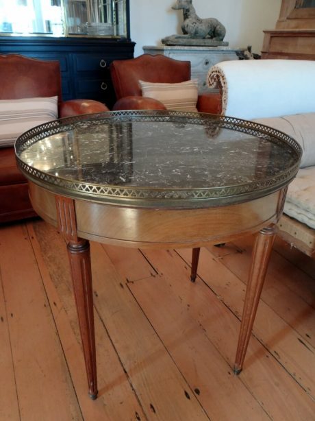 Bouillotte round marble topped table with a brass gallery