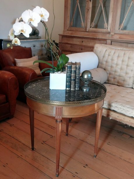 Bouillotte round marble topped table with a brass gallery