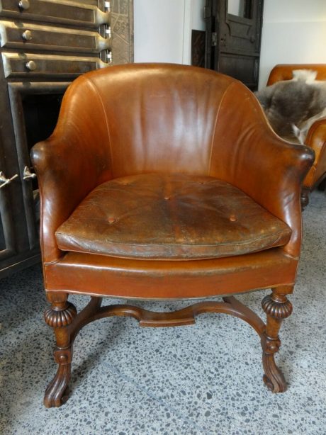 Edwardian leather tub chair on carved oak frame