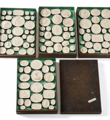 An Italian Grand Tour cased collection of 102 plaster medallions