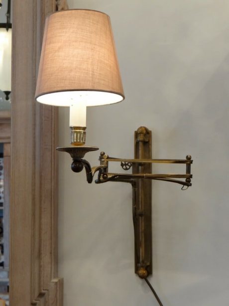 A pair of bronze adjustable wall lamps c.1920