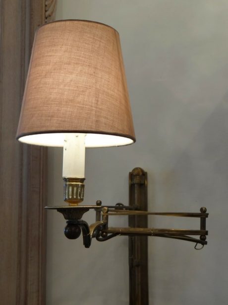 A pair of bronze adjustable wall lamps c.1920