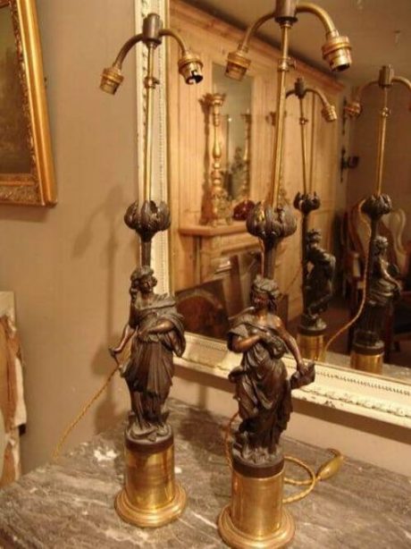 Pair of white metal bronze patina figural lamps