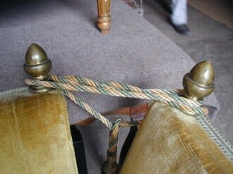 Velvet covered canape with brass finials c.1930