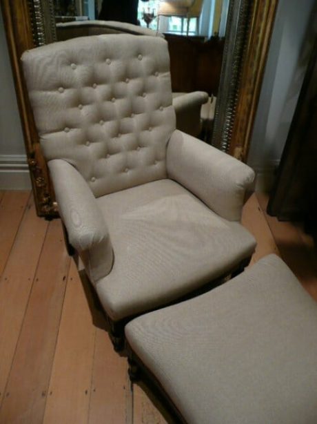Turn of the century bergere chair and footstool recovered in buttonback linen