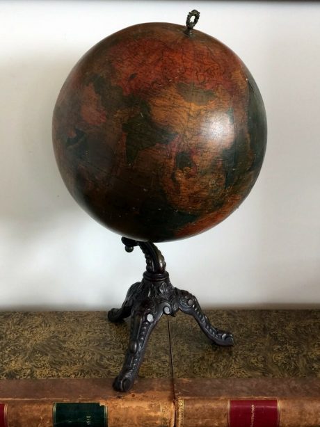 Mid century globe paired with Napoleon III cast iron base.