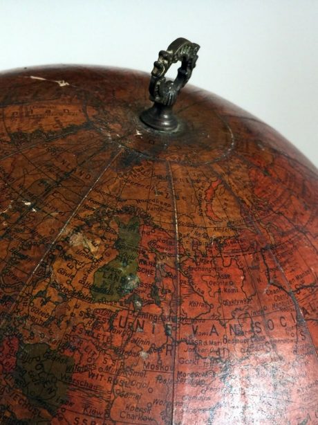 Mid century globe paired with Napoleon III cast iron base.