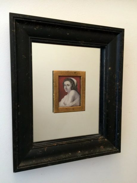Pair of framed handpainted Saint and the Sinner on ivory paintings