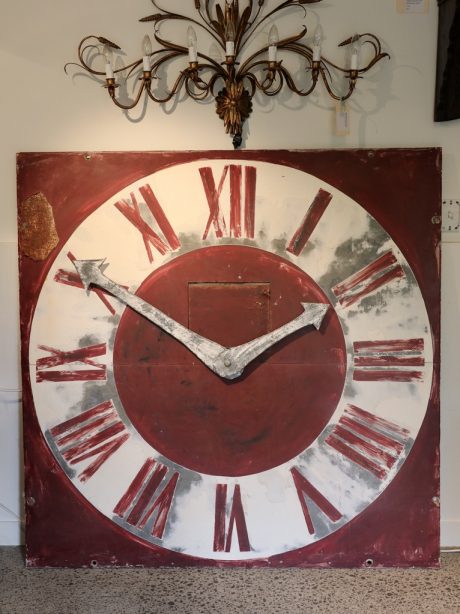 Large metal clock face with new hands made from old zinc