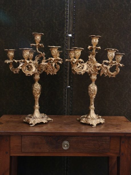 A pair of highly ornate antique French gilded bronze candlesticks c.1860