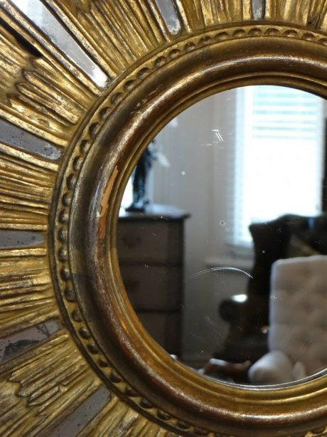 A mid 20th century large round carved and gilt sunburst mirror