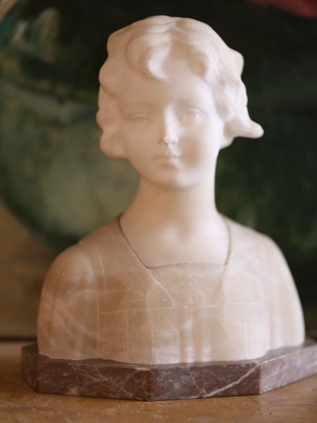 An art deco carved alabaster bust of a young girl c.1920