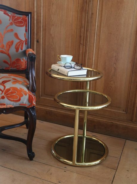 A pair of mid century Milo Baughman style brass side tables