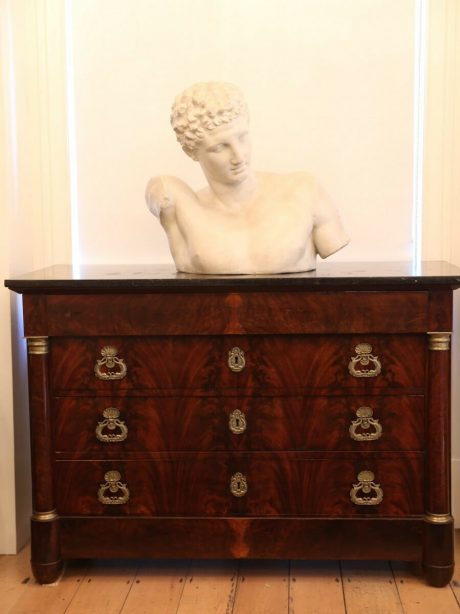 A French flame mahogany Empire commode c.1840