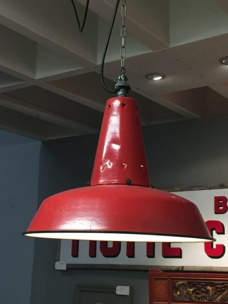 A trio of vintage industrial pendant lights