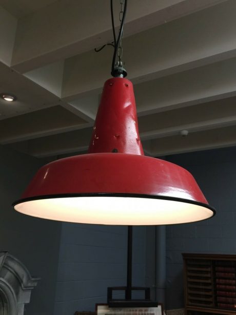 A trio of vintage industrial pendant lights