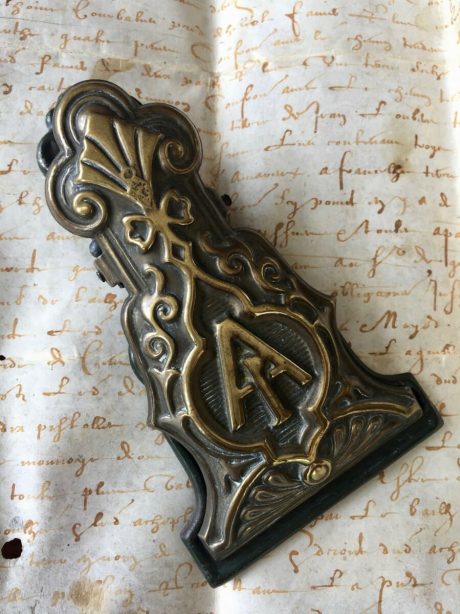 A Victorian brass paperclip with lovely detailed A