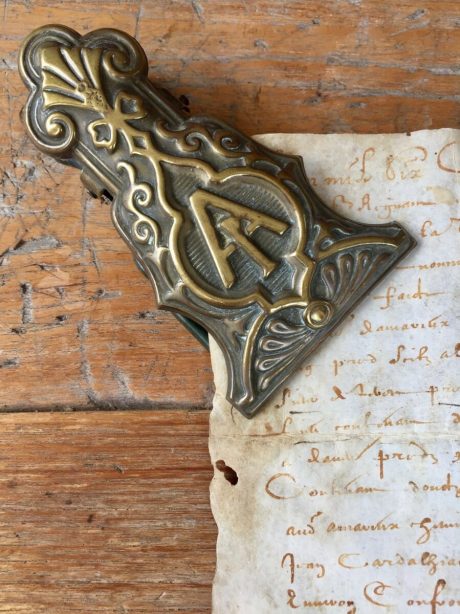 A Victorian brass paperclip with lovely detailed A