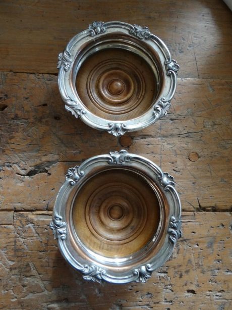 Pair of antique Georgian silver plate wine bottle coasters