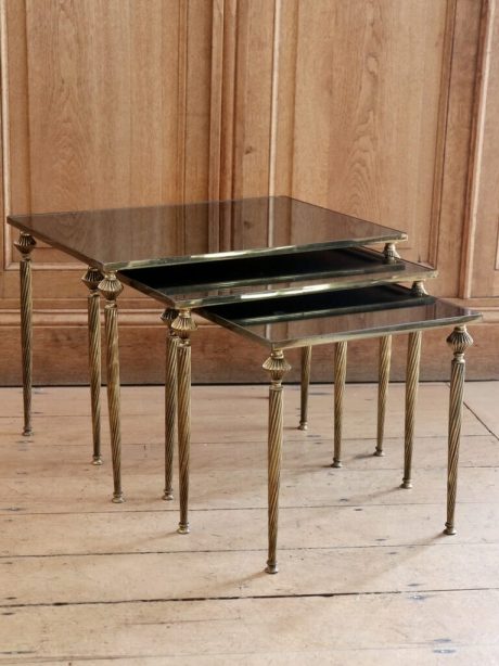 Mid century Brass nesting tables with mirrored tops