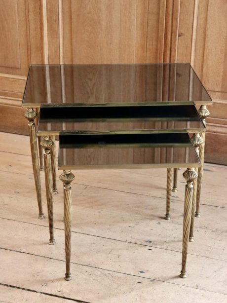 Mid century Brass nesting tables with mirrored tops