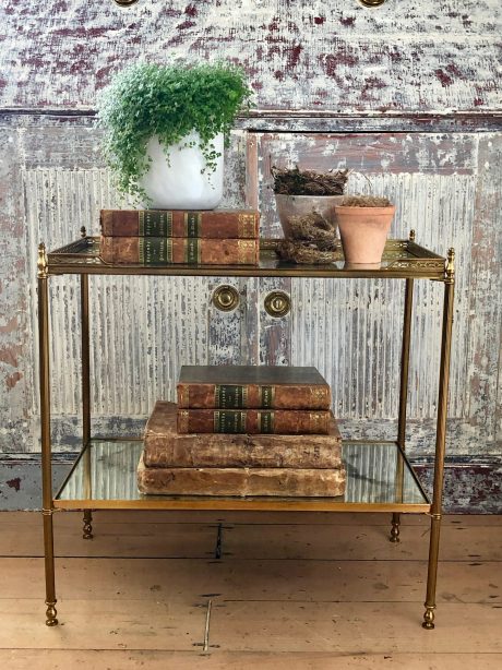 Brass side table with églomisé bronzed mirror