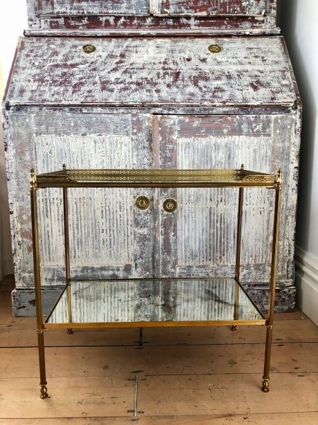 Brass side table with églomisé bronzed mirror