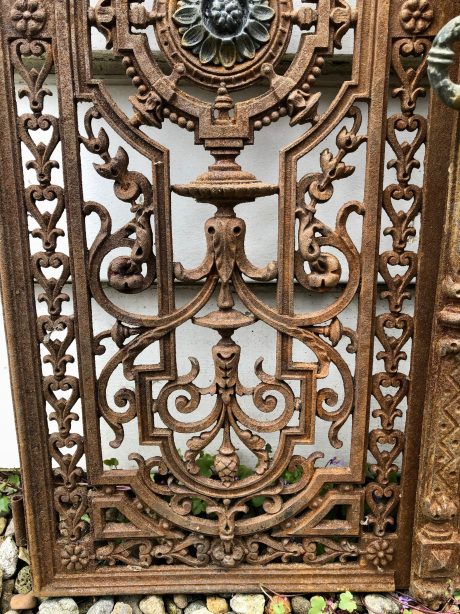 A pair of antique cast iron shutters (likely French or Italian)