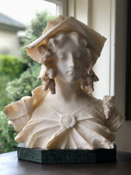 Alabaster Bust of young woman on marble
