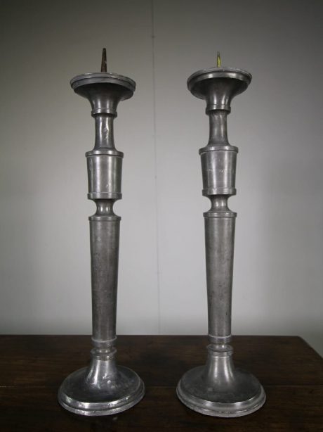A pair of large 19th century pewter candlesticks