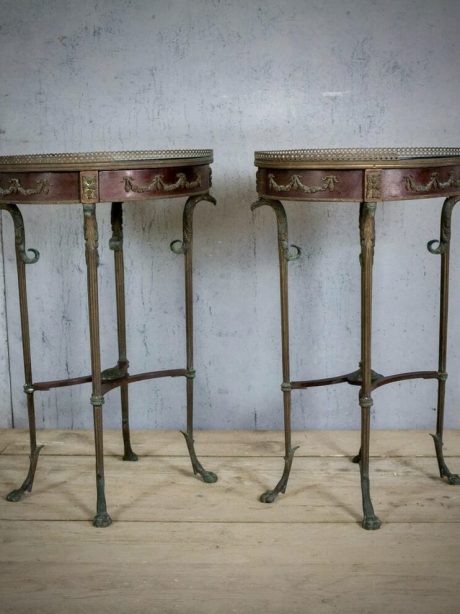 Matching pair of oval antique bronze legged side tables