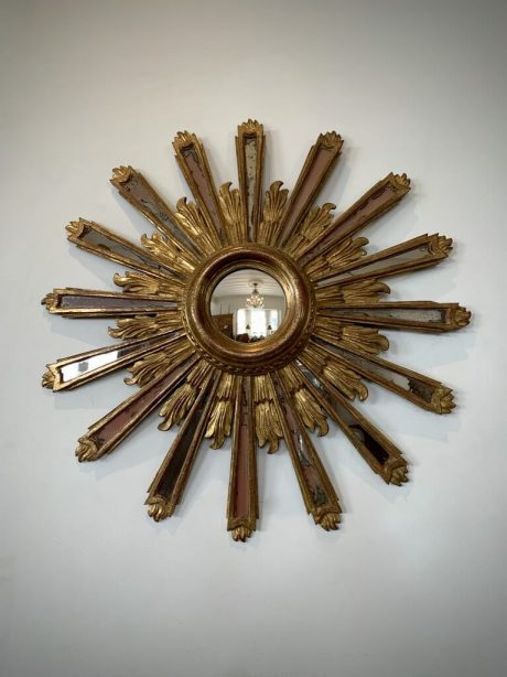 French gilt wood sunburst mirror with celestial mirrored rays