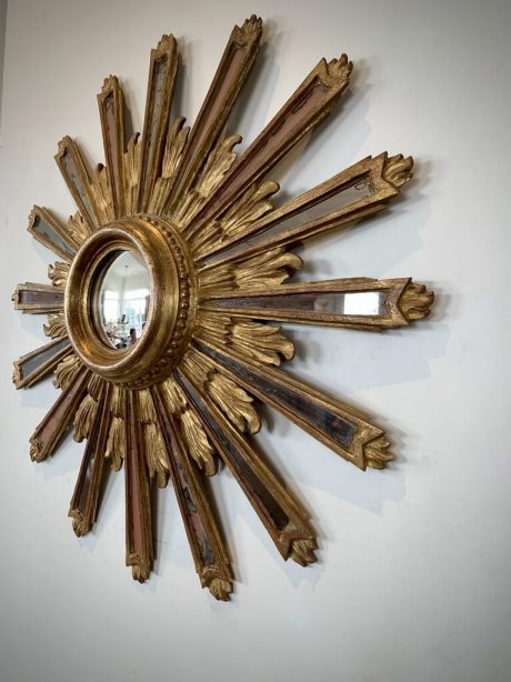 French gilt wood sunburst mirror with celestial mirrored rays