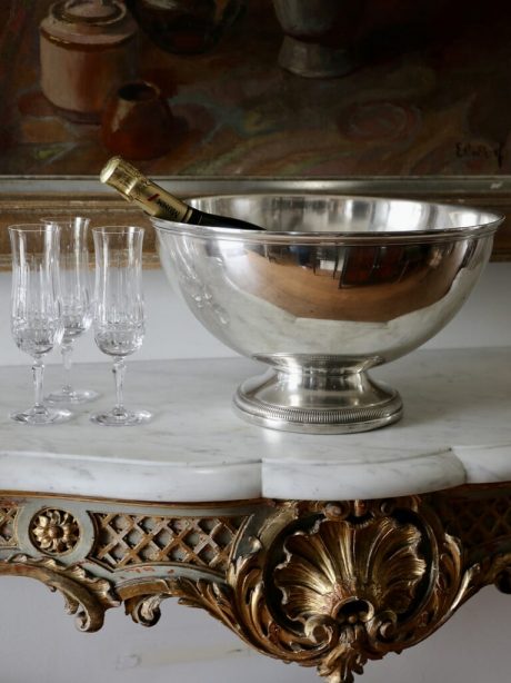 A large silver plated champagne bucket