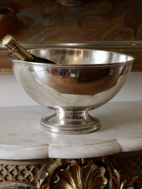 A large silver plated champagne bucket