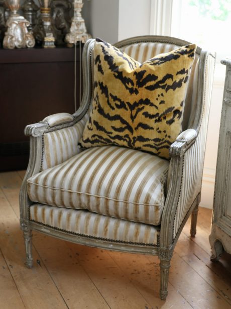 A pair of painted Louis XVI style wingchairs c.1950